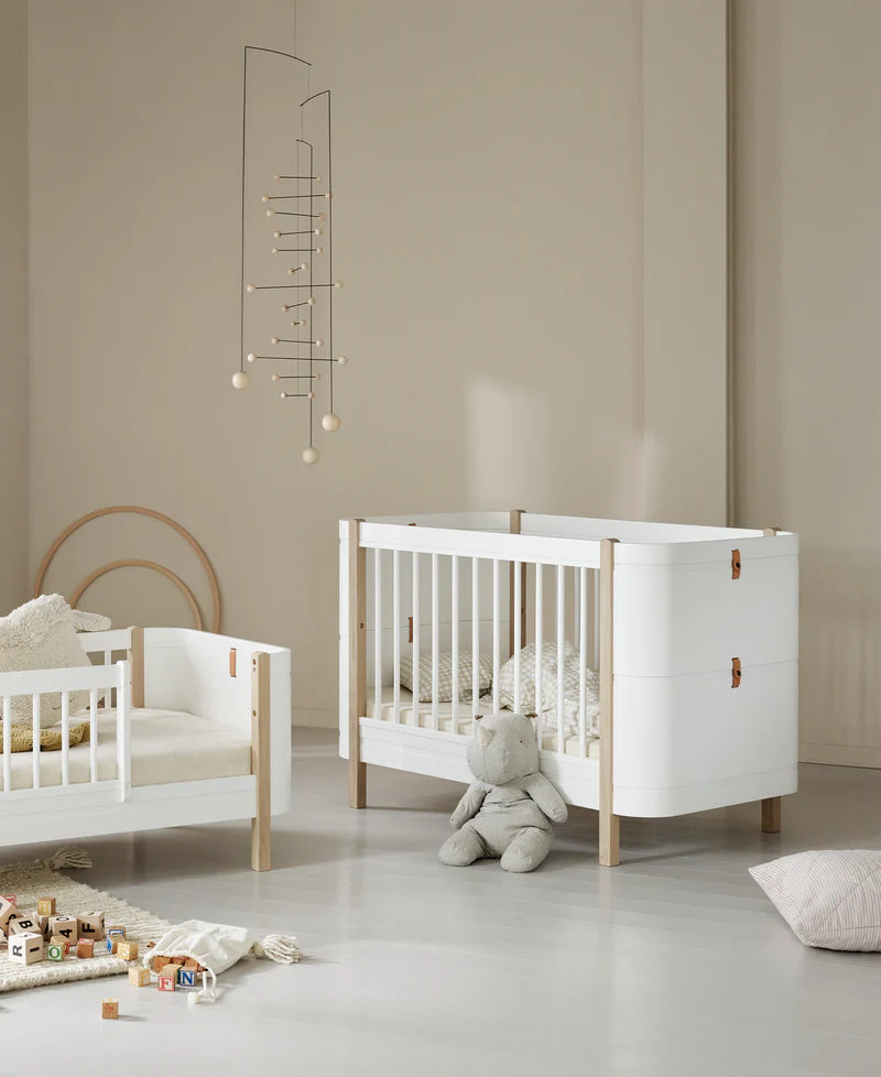 Oliver furniture Mini + cot in a nursery setting