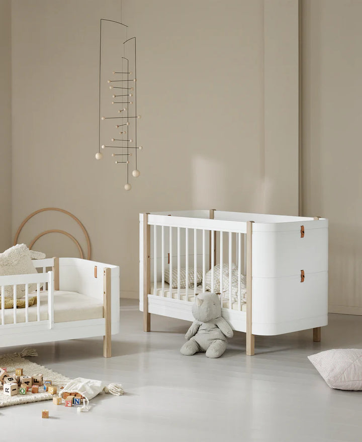 Oliver furniture Mini + cot in a nursery setting