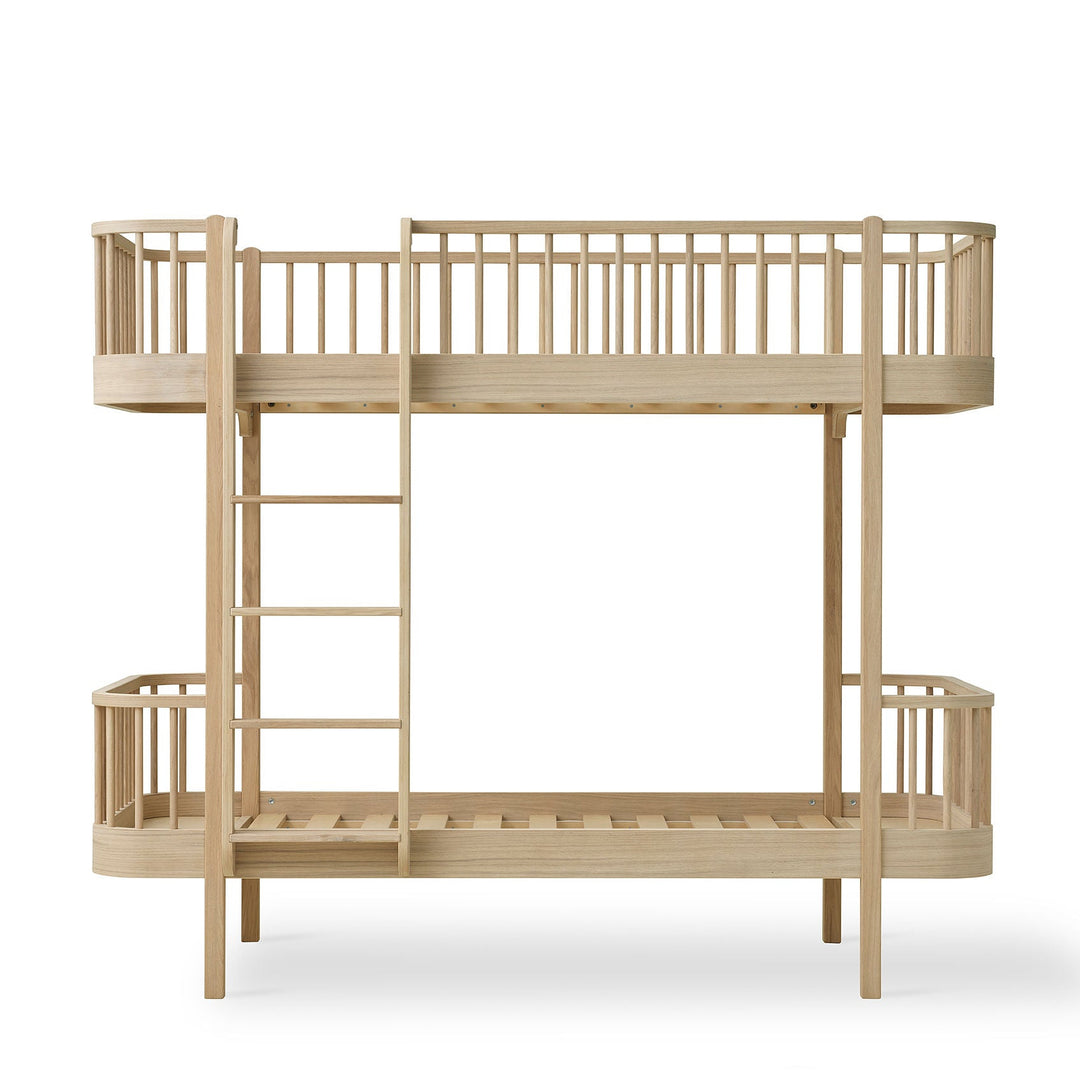 Oliver Furniture oak Wooden bunk bed with a ladder on a white background