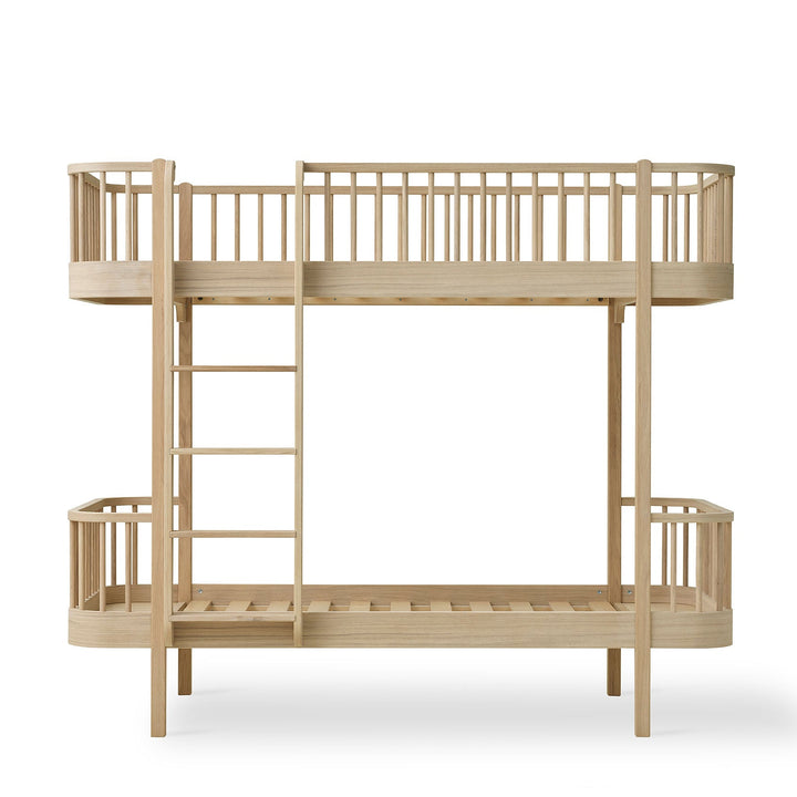 Oliver Furniture oak Wooden bunk bed with a ladder on a white background