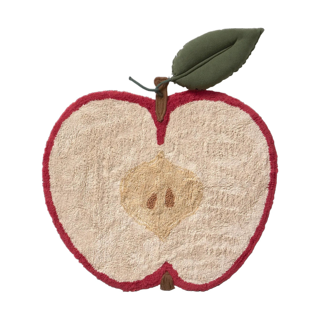 Lorena Canals Machine washable novelty apple-shaped kids rug featuring a textured off-white interior with a tan seed detail, a red stitched border, and a green leaf on a stem, shown against a plain white background.