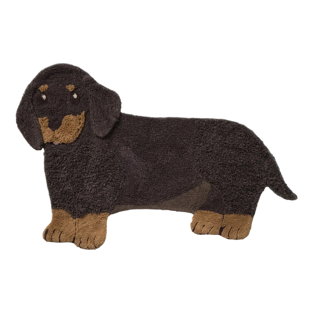A plush dachshund dog rug by lorena canals  in dark brown with tan accents, shown against a plain white background.